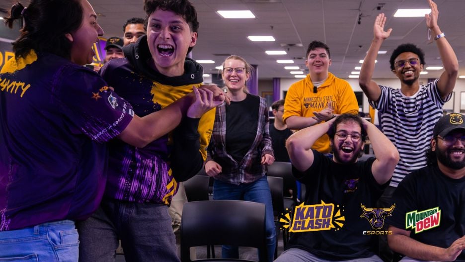 Student audience members cheering at the Kato Clash esports event. Logos for Maverick Esports and Mountain Dew