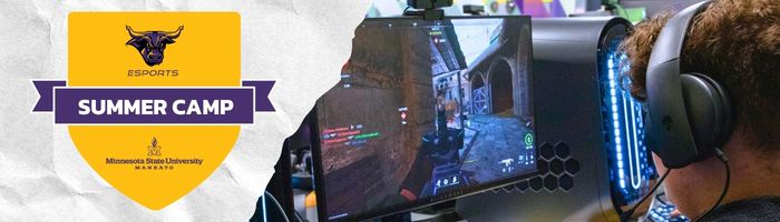 A summer camp student gaming on a PC, wearing headphones